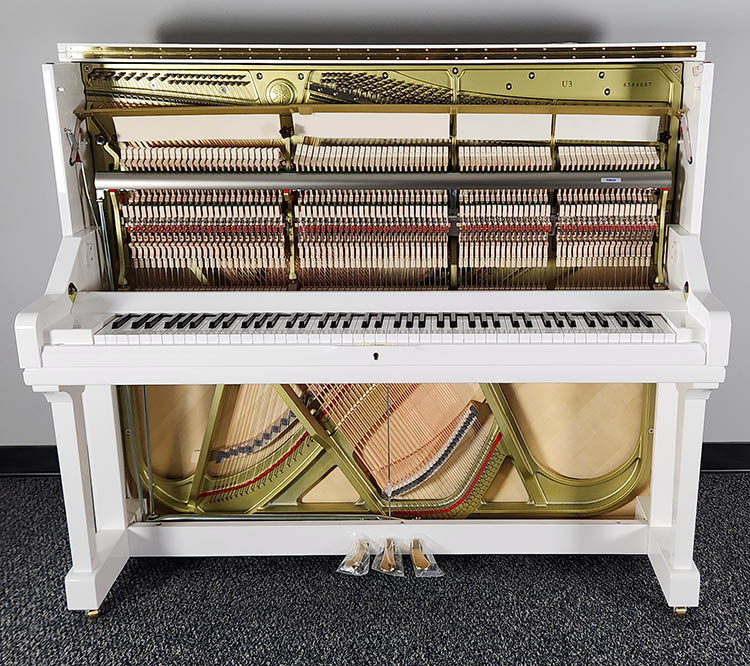 yamaha u3 picture with the top and bottom board removed. you can see the vpro piano harp, piano stings, dampers, and piano action