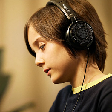 yamaha silent piano being played through headphones